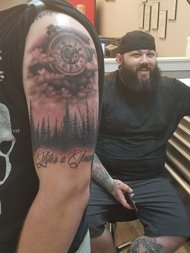 Explore feminine cross tattoo ideas, creative tattoo ideas in Buford, available at Killer Ink