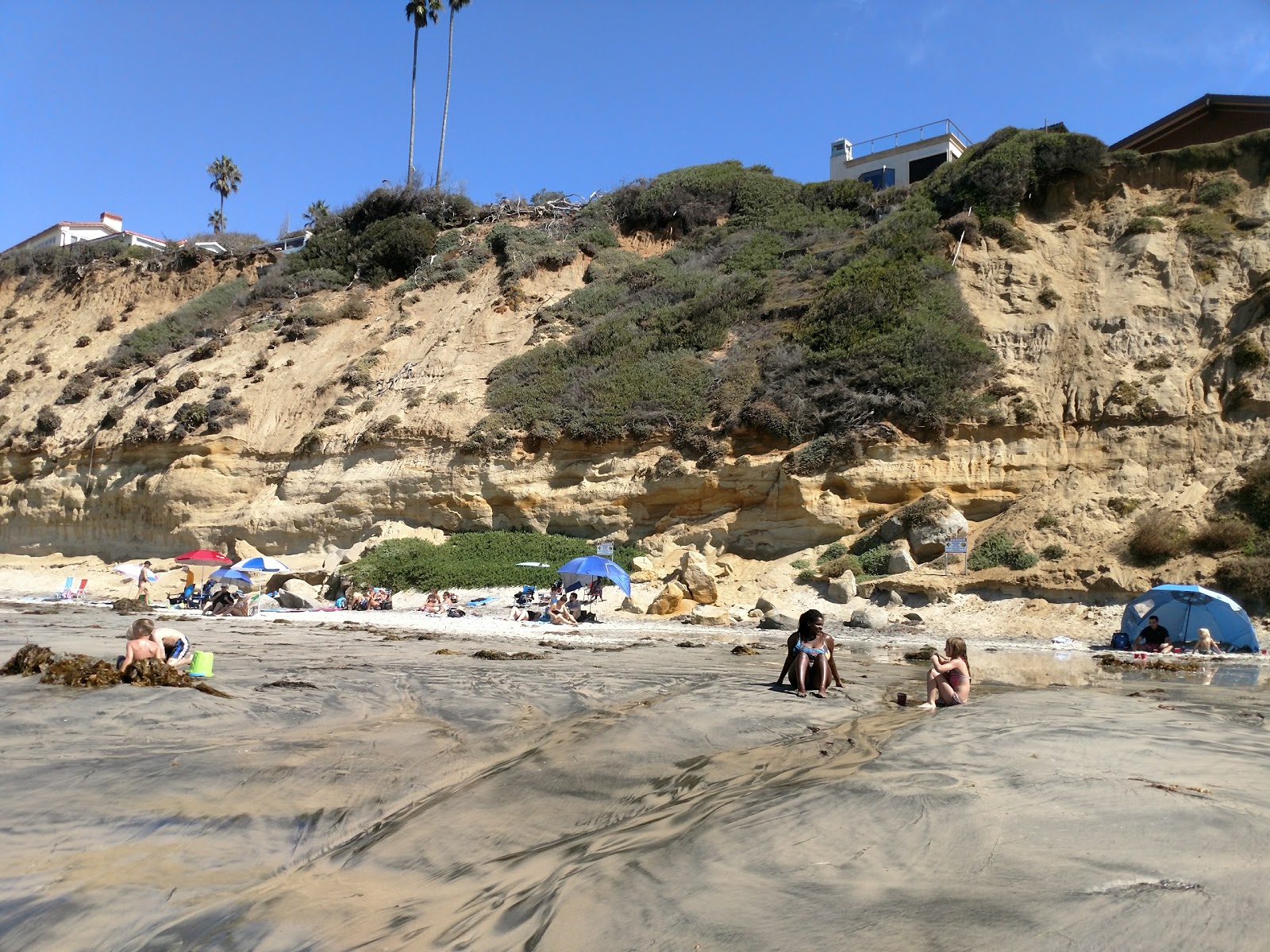 Photo of Moonlight beach surrounded by mountains