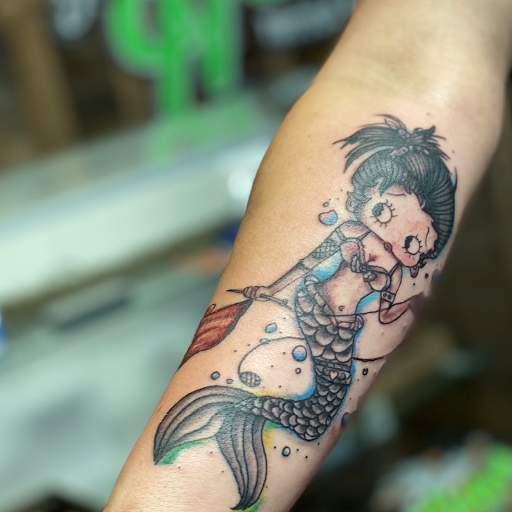 Explore olive tattoo ideas, creative tattoo ideas in Fort Oglethorpe, available at The Helm Tattoo & Piercing
