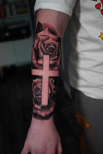 Explore cross tattoo ideas for woman, creative tattoo ideas in Farmingville, available at LizArt Ink tattoo