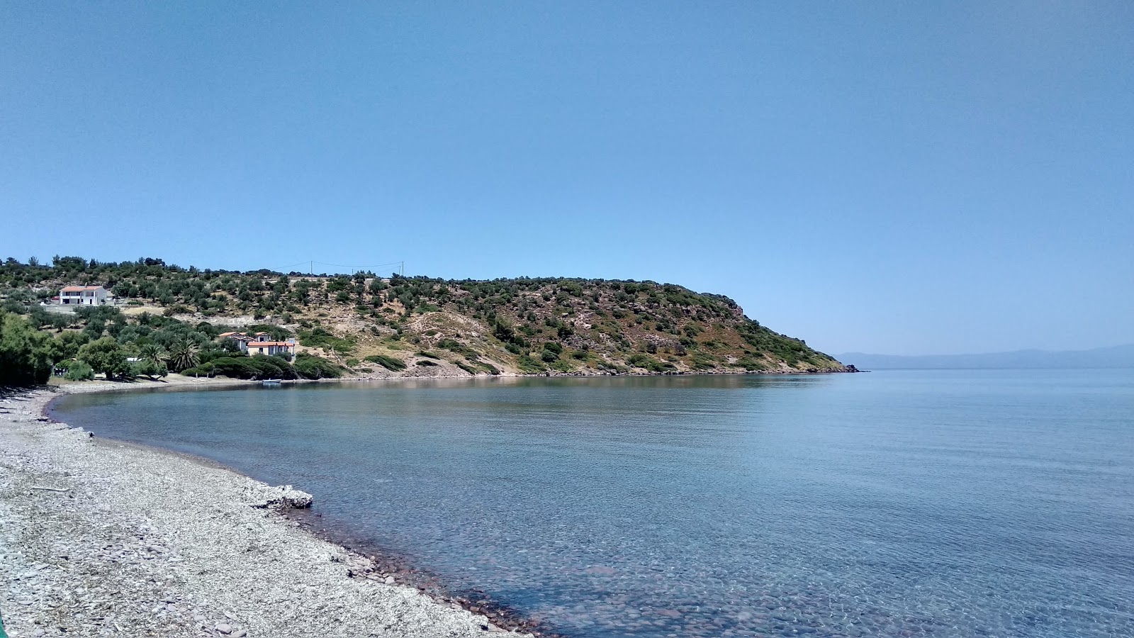 Foto af Xampelia Strand med let sten overflade