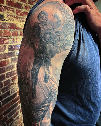 Explore statue tattoo ideas, creative tattoo ideas in Walnut Cove, available at Wildfire Tattoo Studio