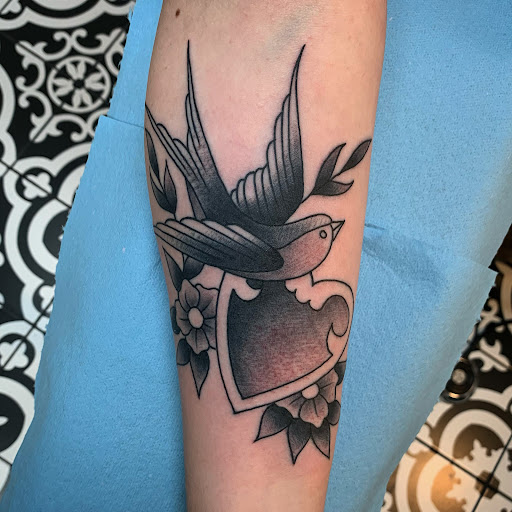 Find small tattoo ideas for mothers for your next unique tattoo in Milwaukee at MANIA Tattoos Milwaukee