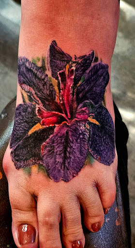 Explore concert tattoo ideas, creative tattoo ideas in Toledo, available at Cross Over Tattoo Studio