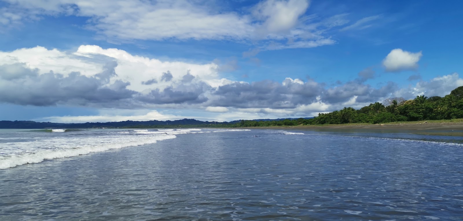 Foto av El Palmar Coronado Beach med lång rak strand