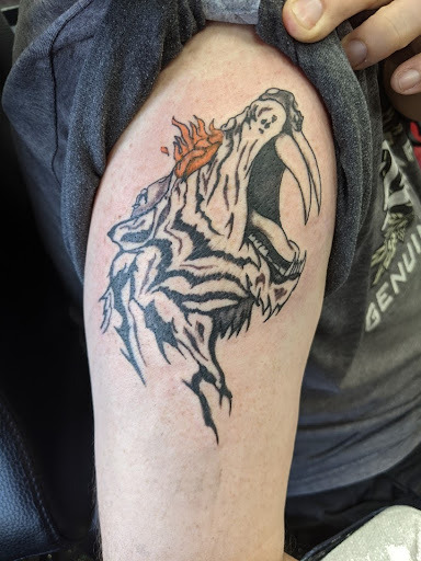 Explore tattoo behind ear ideas, creative tattoo ideas in Slippery Rock, available at Dinky Dachshund Tattoo Parlor