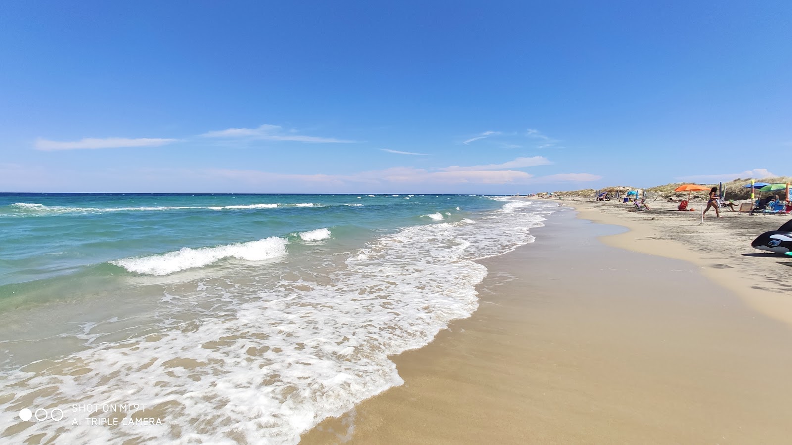 Foto de Spiaggia di Torre Rinalda con brillante arena fina superficie
