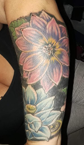 Explore vine tattoo ideas for females, creative tattoo ideas in Fort Mohave, available at RedRum Tattoo & Body Piercing Co.