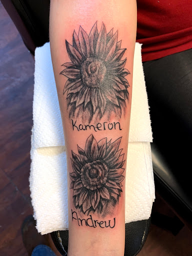 Explore tattoo ideas for black women, creative tattoo ideas in Seymour, available at American Gypsy Tattoo Corp.