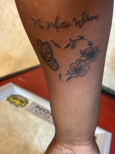 Find lion hand tattoo ideas for men for your next unique tattoo in Spartanburg at Lucky Dice Tattoo Shop Spartanburg