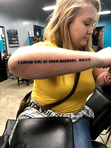 Explore bookworm tattoo ideas, creative tattoo ideas in Huntsville, available at Blessed Ink