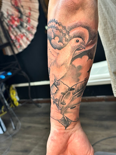 Explore rock and roll tattoo ideas, creative tattoo ideas in Lake Charles, available at Brand-X Tattoo & Piercing