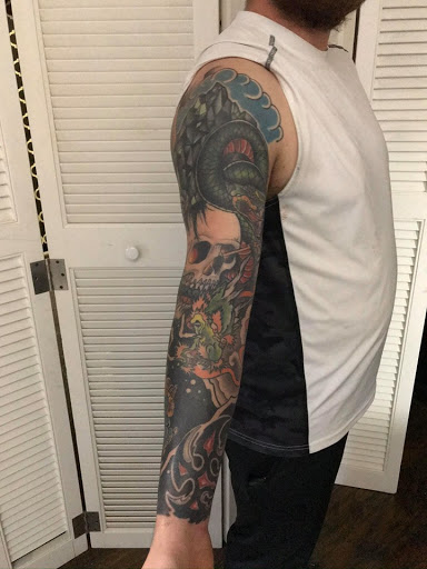 Explore cross cover up tattoo ideas, creative tattoo ideas in Kingsford, available at Deft Tattoo Studio