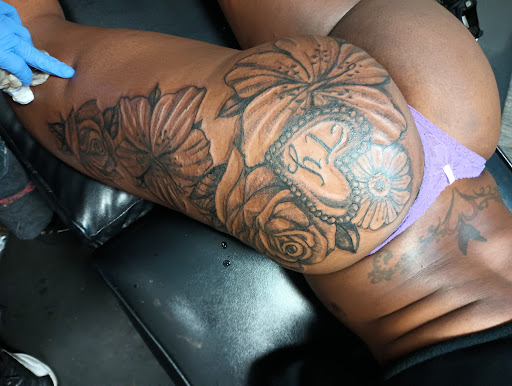 Explore men's back shoulder tattoo ideas, creative tattoo ideas in Detroit, available at Swagg Shop (tattoos and piercings)