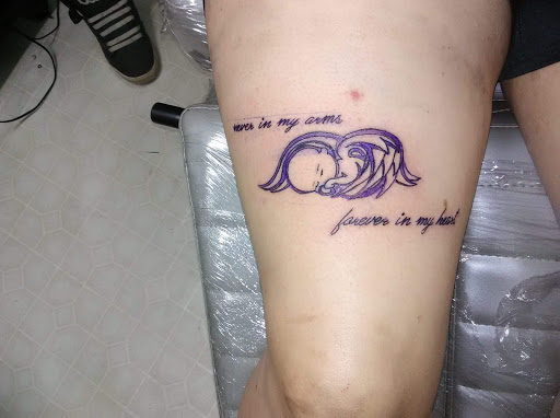 Explore mens tattoo ideas upper arm, creative tattoo ideas in Paris, available at Twizted Dezignz