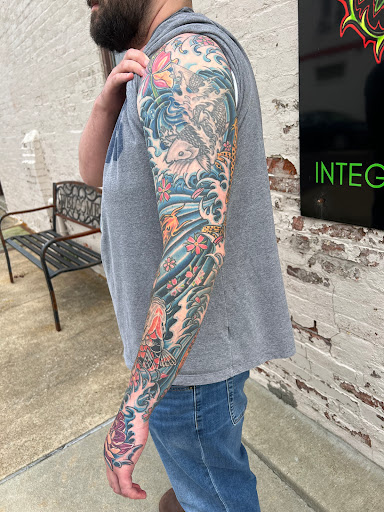 Explore black and white sleeve tattoo ideas, creative tattoo ideas in Belleville, available at Integrity Tattoos