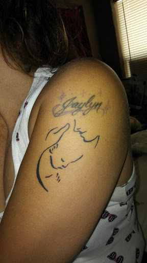 Find wolf tattoo ideas for females for your next unique tattoo in West Palm Beach at GURU Tattoo & Piercing - Palm Beach County