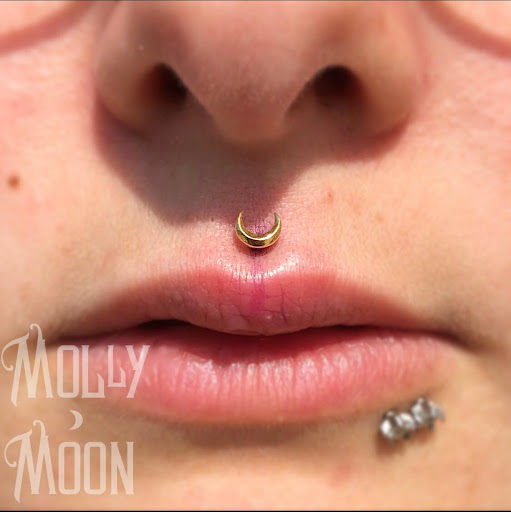 Explore mickey mouse tattoo ideas, creative tattoo ideas in Oshkosh, available at Piercings by Molly Moon at 920 Tattoo and Piercing