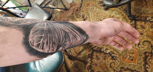 Explore man hand tattoo ideas, creative tattoo ideas in Kerhonkson, available at RedHawk Tattoos