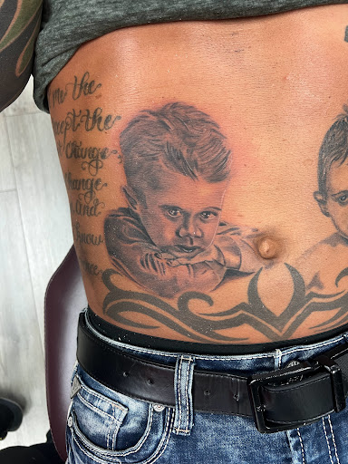 Explore wedding ring tattoo ideas for him, creative tattoo ideas in Youngstown, available at Twisted Metal Custom Body Art