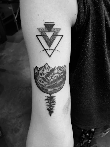 Explore lower belly tattoo ideas, creative tattoo ideas in Asheville, available at Serpent & the Rainbow Tattoo