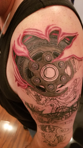 Explore upper arm sleeve tattoo ideas, creative tattoo ideas in Coral Springs, available at Salvation Tattoo Lounge Coral Springs