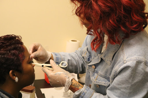 Explore hand tattoo ideas men, creative tattoo ideas in Detroit, available at Sacred Heart Tattoos