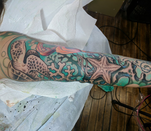 Tattoo Shop «Eclectic Art Tattoo Gallery», reviews and photos, 615 E Michigan Ave, Lansing, MI 48912, USA