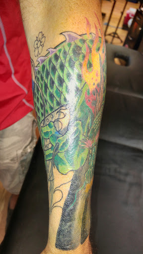 Explore whiskey tattoo ideas, creative tattoo ideas in Le Roy, available at Blood Money Ink