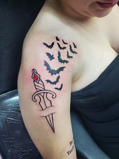 Explore tattoo ideas for mens thigh, creative tattoo ideas in Cocoa, available at Rorschach Tattoo Shop and Piercing Studio