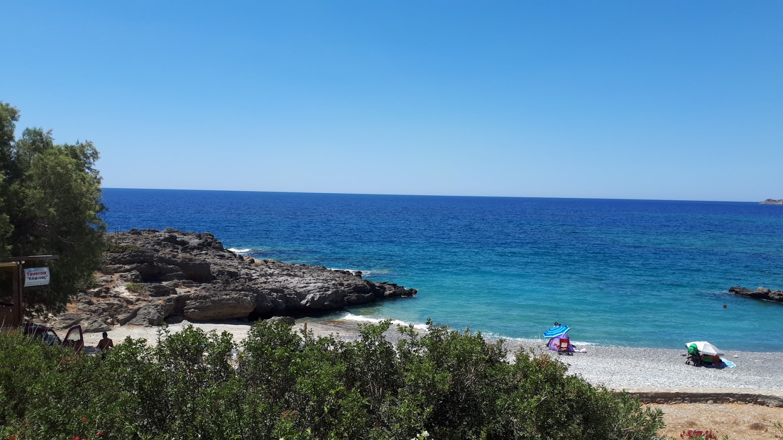 Foto av Agios Ioannis beach med turkos rent vatten yta