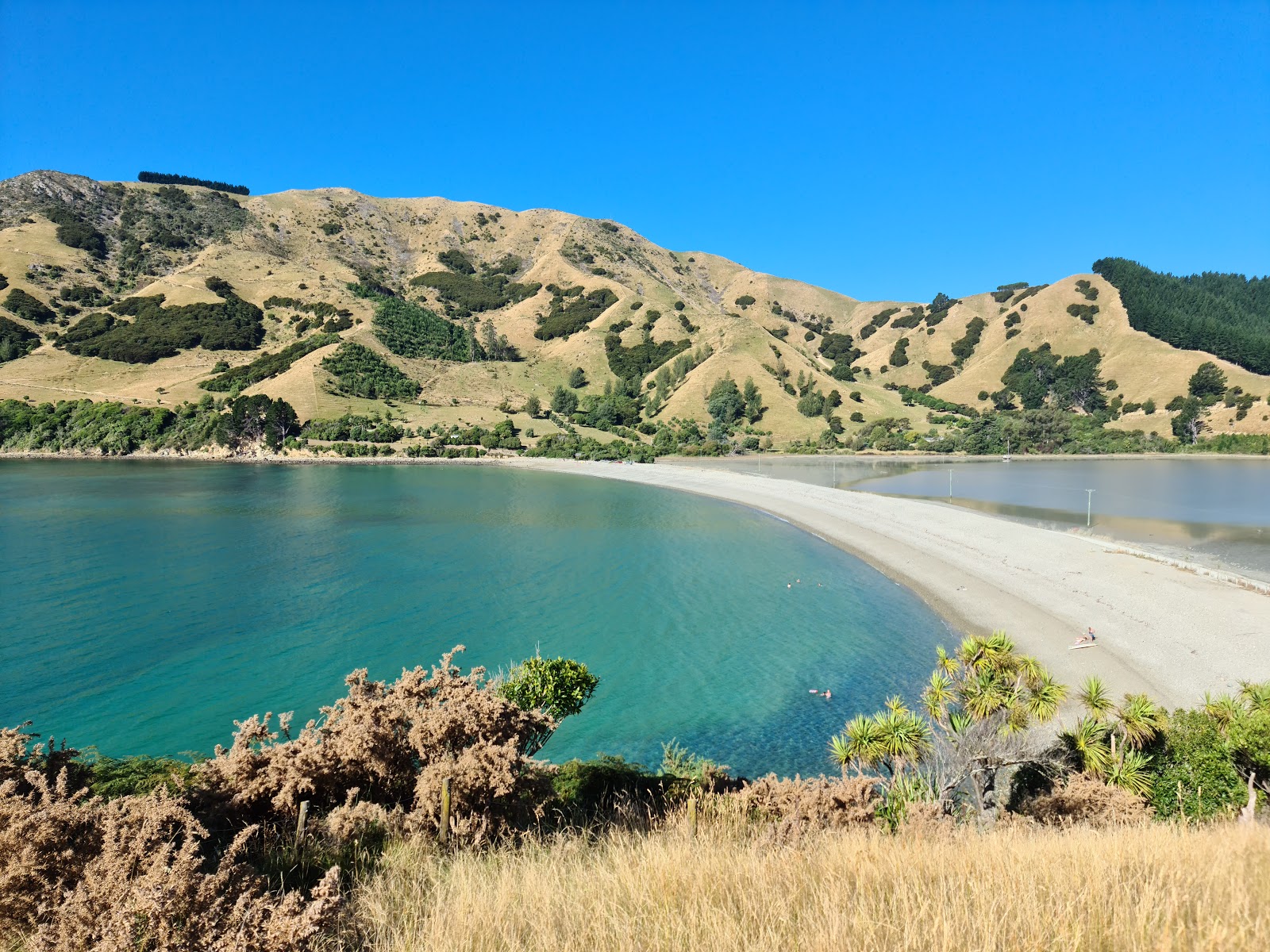Photo of Cable Bay Beach with turquoise pure water surface