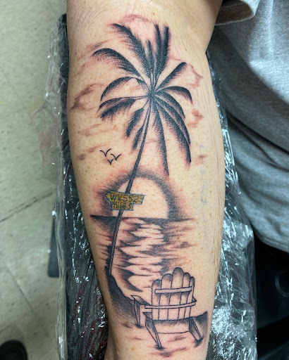 Explore breast cancer ribbon tattoo ideas, creative tattoo ideas in Marietta, available at Monkeys Uncle Tattoo