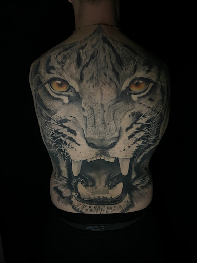 Explore neck tattoos for men ideas, creative tattoo ideas in Steubenville, available at Garloch Tattooing