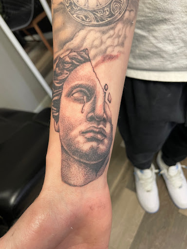 Explore throat tattoo ideas for males, creative tattoo ideas in Elmira, available at Silva Ink Gallery