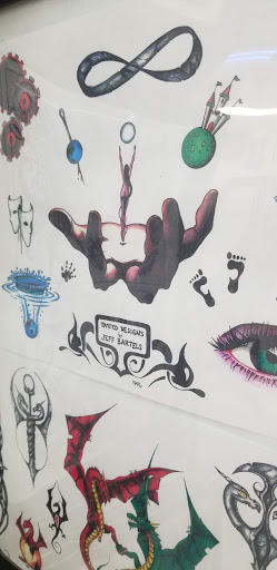 Explore microphone tattoo ideas, creative tattoo ideas in Wilmington, available at Hardwire Tattoo & Body Piercing