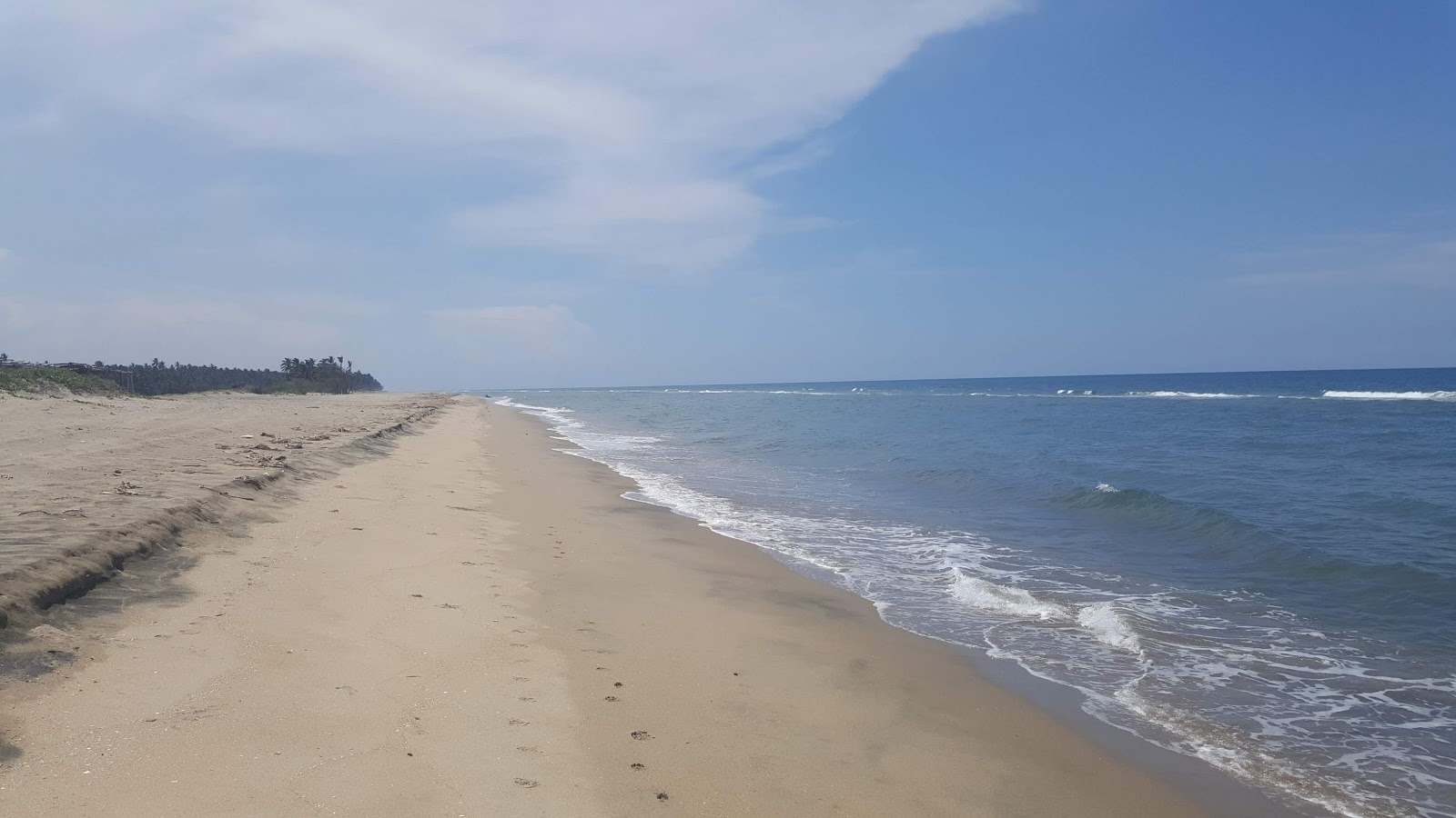 Fotografija Tupilco Beach z svetel pesek površino