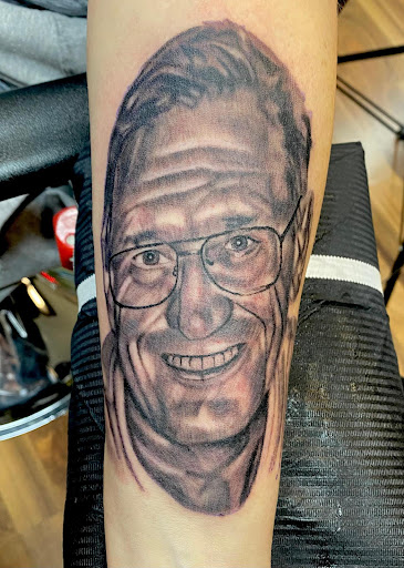 Explore tattoo ideas for son on dad, creative tattoo ideas in Chicago, available at Shreds Inferno Custom Tattoos