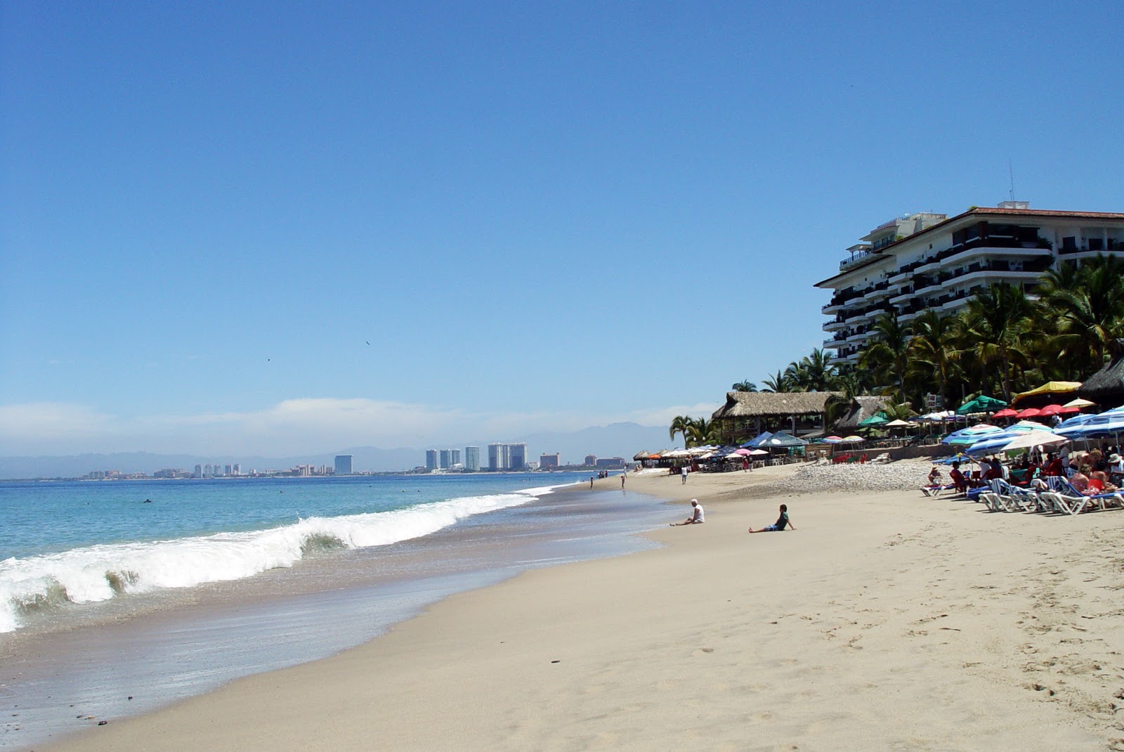 Olas Altas beach的照片 带有明亮的沙子表面