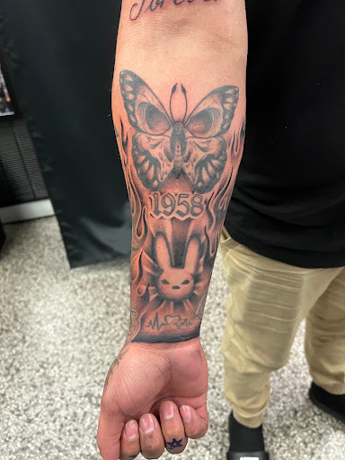 Explore thigh tattoo ideas for women, creative tattoo ideas in Sanford, available at Luv Ink