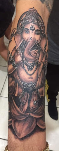 Explore manifestation tattoo ideas, creative tattoo ideas in Ocoee, available at Slaughterized Ink Tattoo and Piercing Studio