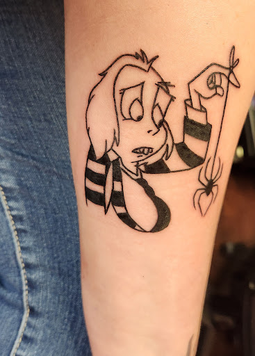 Explore arm tribal tattoo cover up ideas, creative tattoo ideas in Pinellas Park, available at Lollis Studios Tattoo Company