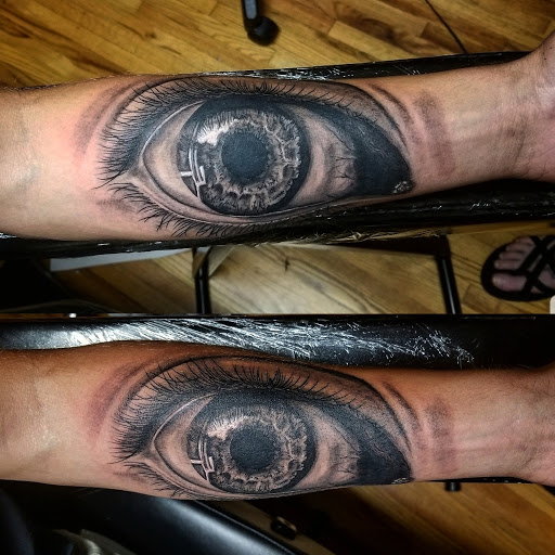 Explore back hand tattoo ideas, creative tattoo ideas in Asheboro, available at Wonderland Tattoo