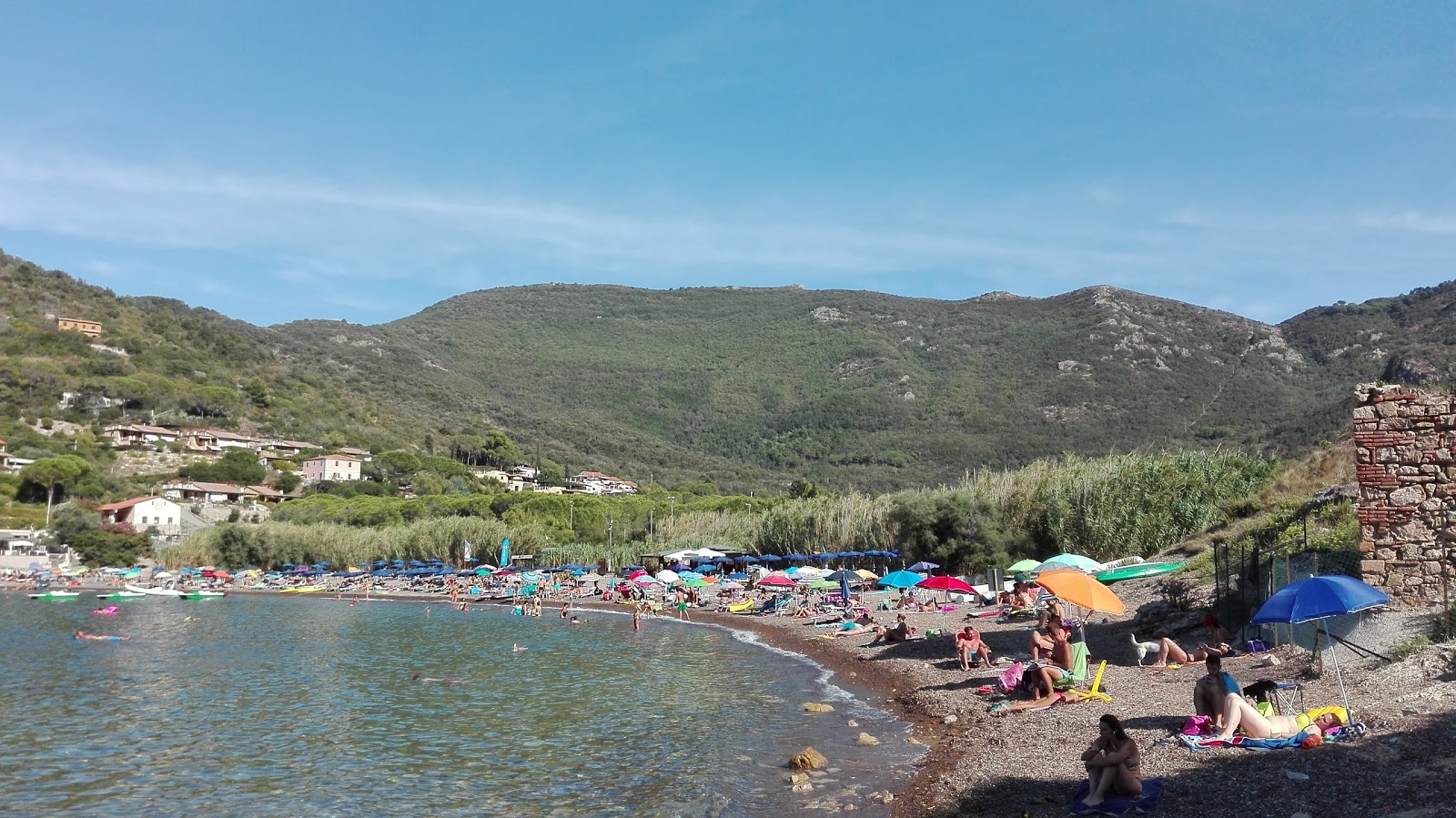 Photo of Nisporto Beach surrounded by mountains