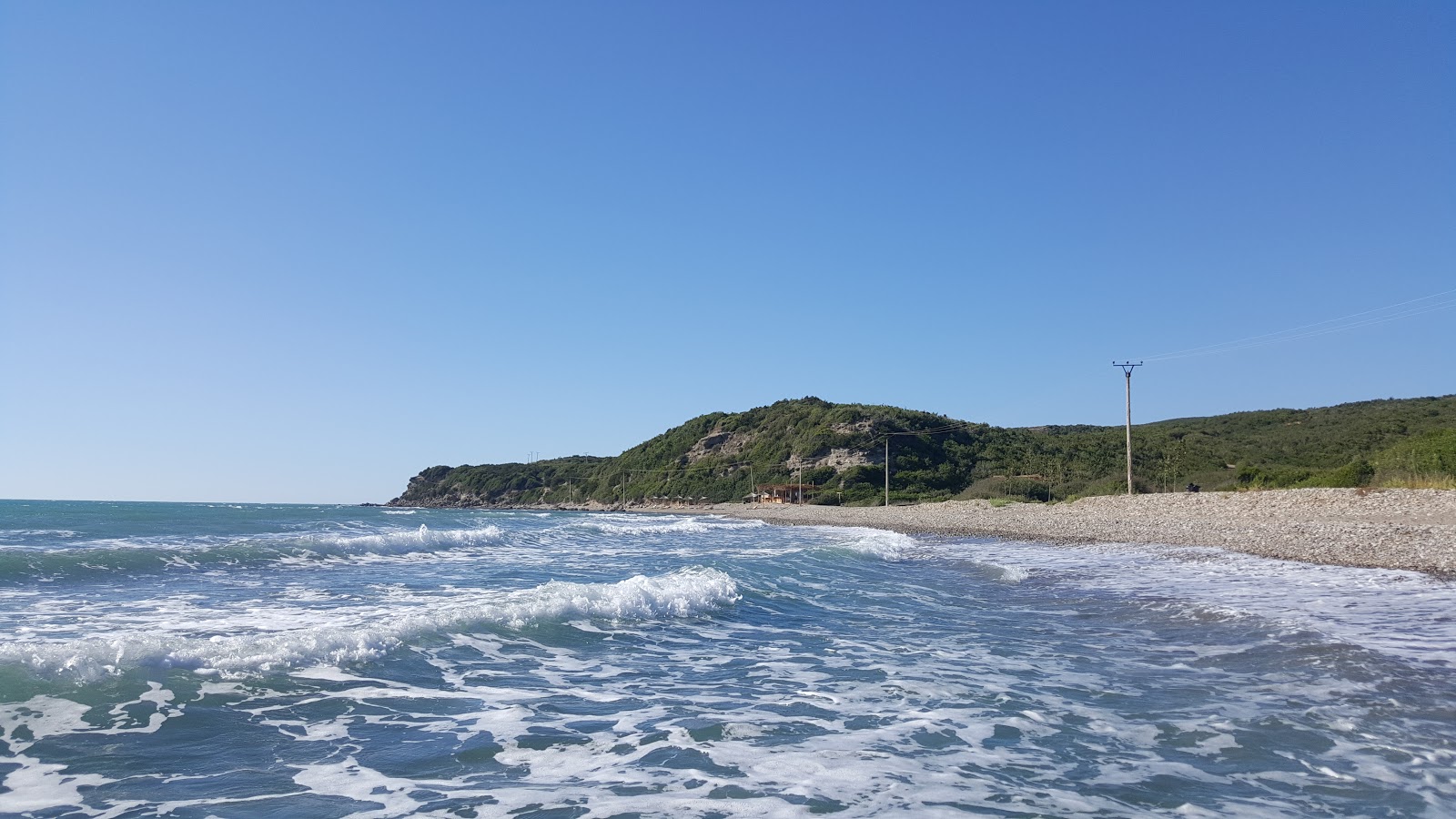 Foto di Gjeneralit II beach con una superficie del sabbia marrone