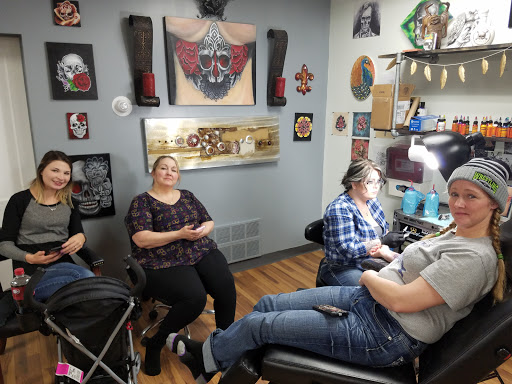 Explore mens upper arm tattoo ideas, creative tattoo ideas in Watford City, available at The Ink Well Tattoo & Body Piercing