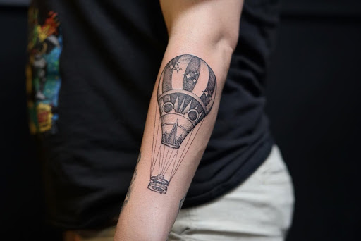 Explore red cardinal tattoo ideas, creative tattoo ideas in Orange Park, available at Big City Tattoo and Piercing