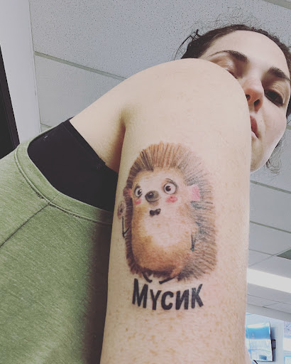 Explore red ink neck tattoo ideas, creative tattoo ideas in Maryland Heights, available at Thirteen Roses Tattoo & Aesthetics