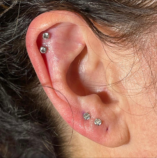 Explore joker hand tattoo ideas, creative tattoo ideas in Bakersfield, available at Vixen Body Piercing