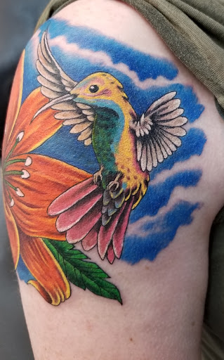 Explore flower spine tattoo ideas, creative tattoo ideas in Georgetown, available at Body Art Tattoos